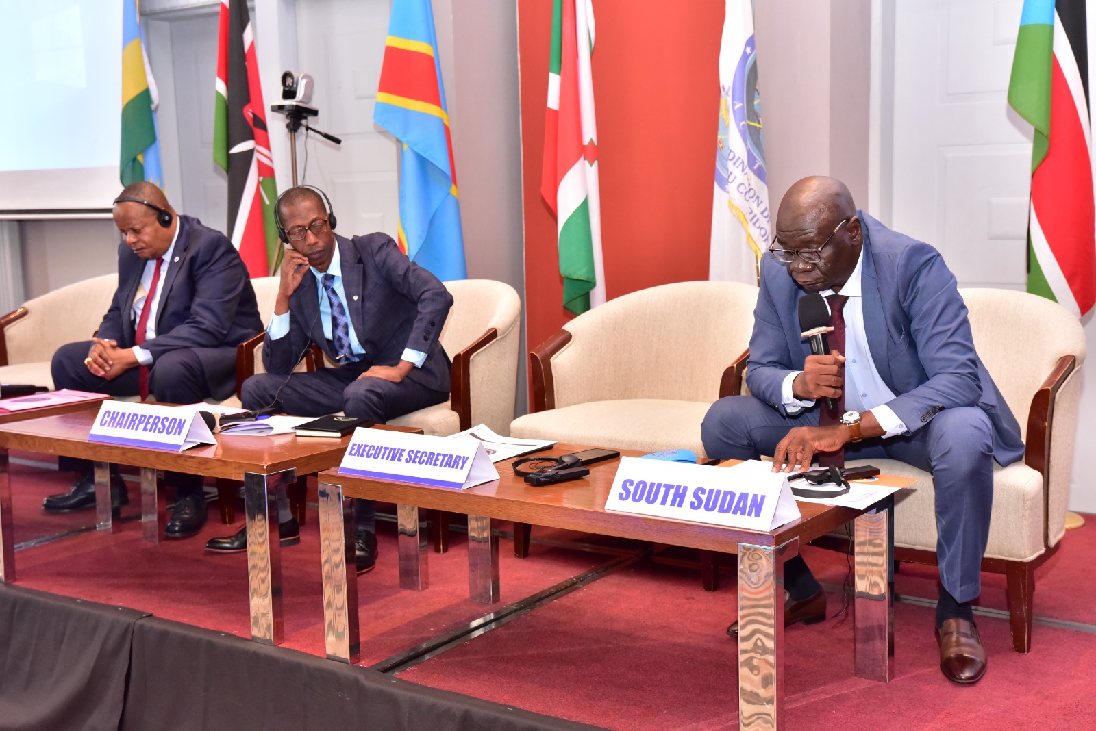 South Sudan’s Minister for Transport Rizik Zakaria Hassan (right) flanked by Burundi’s Minister for nfrastructure, Social Housing, Transport and Equipment, Egide Niyimbere (Left) speaking during the 38th NCTTCA Council of Ministers meeting in Nairobi.