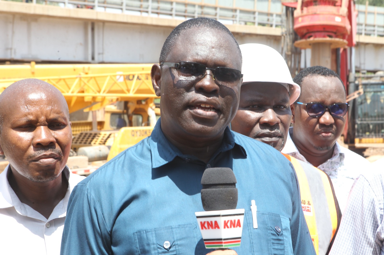 North Eastern Regional Commissioner John Otieno  addressing the press at the new Tana Bridge construction site during an inspection tour. 