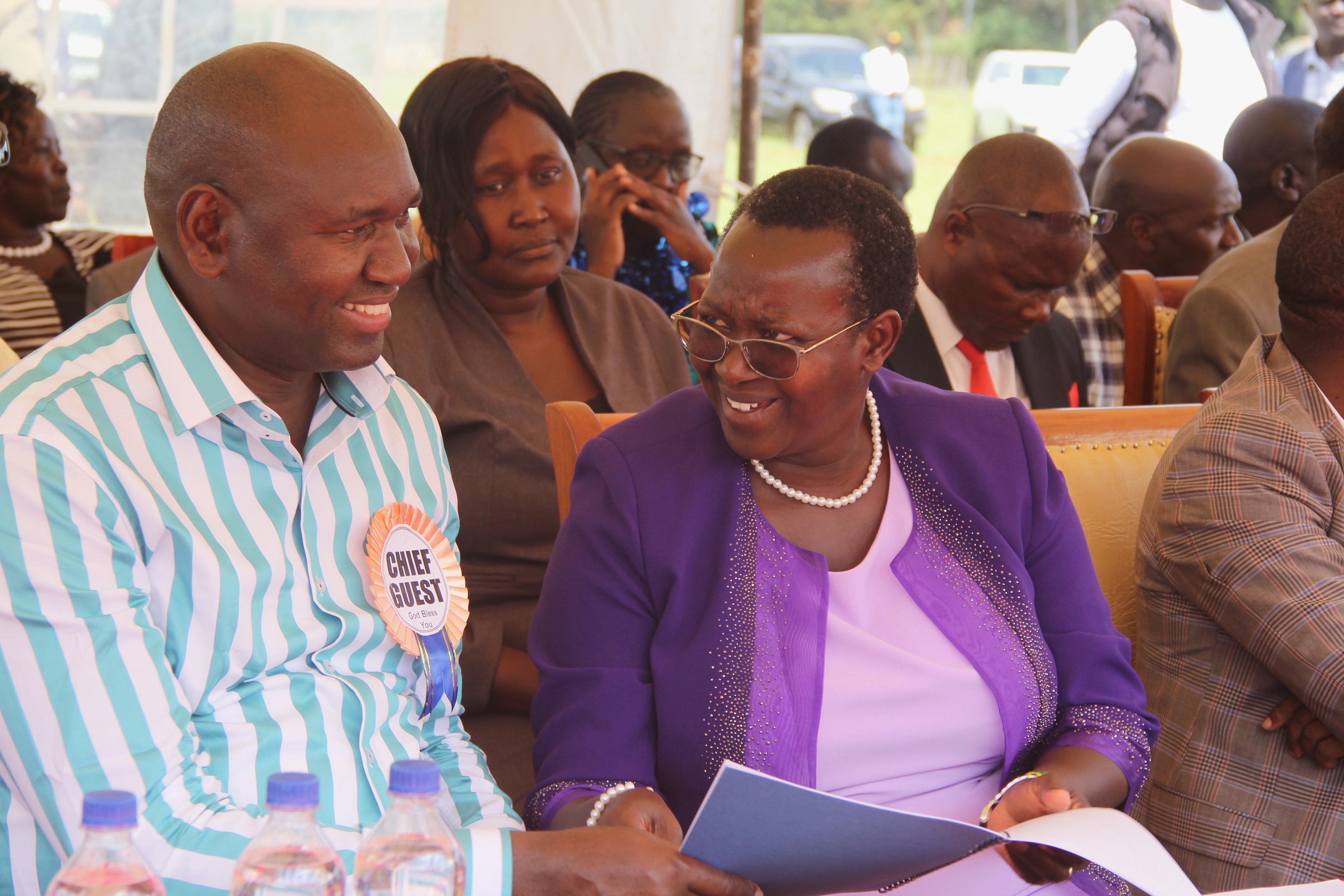 Basic education PS Amb. Prof. Julius Bitok (L) in consultation with Turbo MP Janet Sitienei.