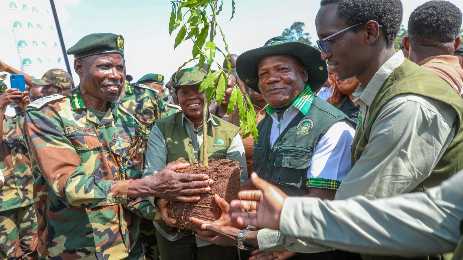 Environment, Climate Change and Forestry CS Dr. Deborah Barasa (centre), Kakamega Governor Fernandez Barasa (on her left) and other government officials hold a tree seedling before planting several tree seedlings in degraded areas of Kakamega tropical forest during the marking of this year’s World Rainforest Day.