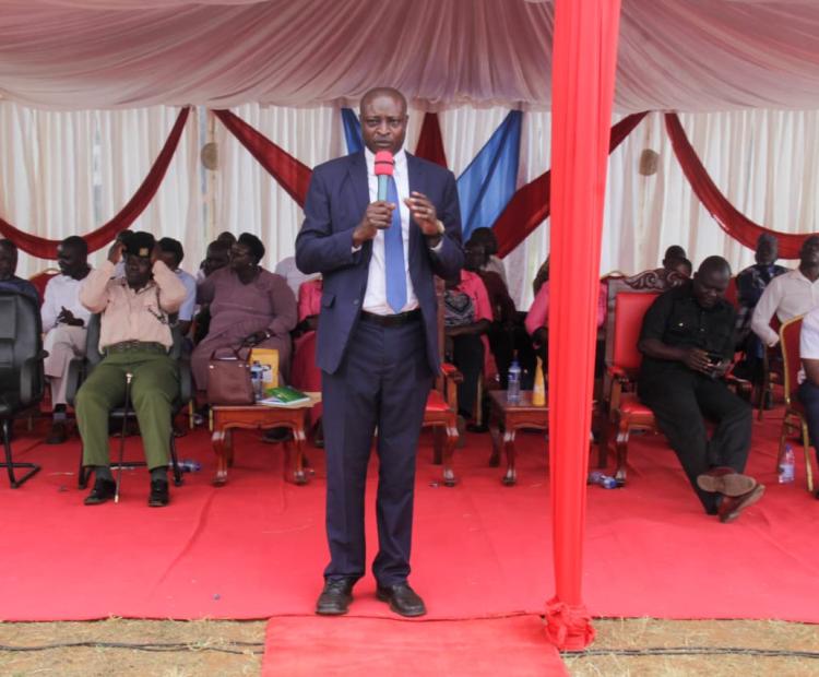 The Director in the State Department for East African Community Affairs, Musa Okwemba, addressing stakeholders at Busia Vocational Training Centre grounds.