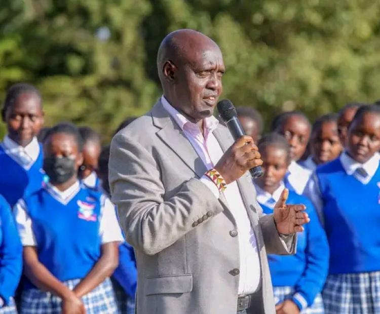 Basic Education Principal Secretary John Ololtuaa addresses students and members of the education fraternity during a courtesy visit to Hill School Senior School in Eldoret, Uasin Gishu County.